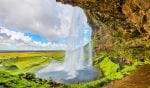 At the back of Seljalandsfoss waterfall – Iceland