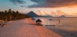 Aerial view of Flic and Flac, Mauritius in sunset light. Exotic beach sunset.