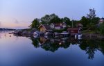 Day 8. Stockholm Archipelago: Cape with summer houses and fishing stalls in Vaxholm a beautiful summer evening